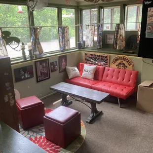 a red couch and a coffee table