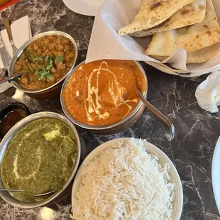 Butter Chicken, butter naan, saag paneer &amp; channa masala.  Not pictured: Veggie samosas &amp; cheese naan All delicious!