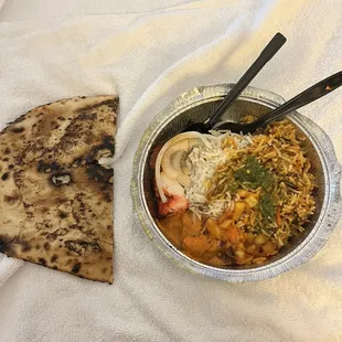 A mixture of the food we ordered, and paan bread to the left. It's traditional bread ate with Indian food. So so good