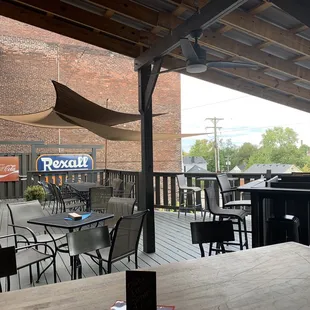 a patio with tables and chairs
