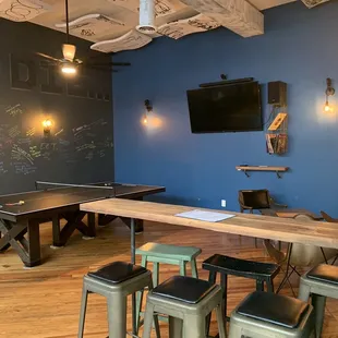 a game room with a pool table