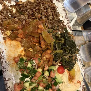 Vegetarian platter - Majadra, Loubee, Sleek, Hummus, Fattoush salad...after we already helped ourselves to a good bit !