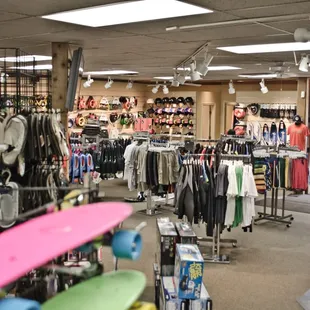 the front room with t-shirts and shorts for summer board sports