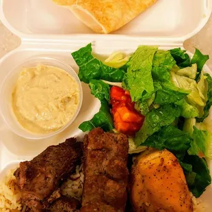 Combo plate with Lula, chicken and steak kebabs, baba ghanouj, Armenian rice pilaf, house salad and bread.