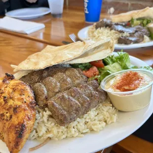 2 plates with Chicken Kabob, Lula Kabob, and Steak Kabob