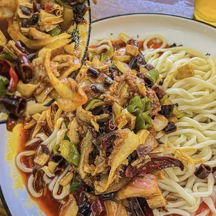 **Spicy Stir-fried Beef Tripe Noodles** (Extra Spicy)   Hand-pulled noodles stir-fried with spicy beef tripe, Mexican chilies