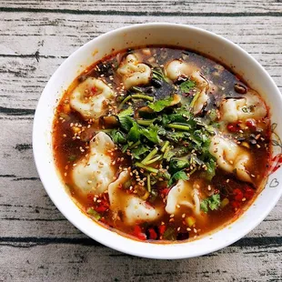 Soup dumplings with House special sauce and Cllantro