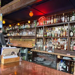 a bar with many bottles of alcohol