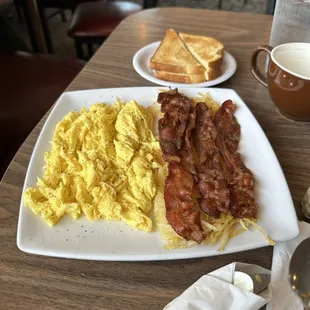 Eggs, bacon, hash browns, and toast