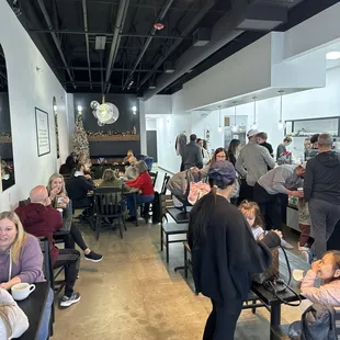 a large group of people sitting at tables