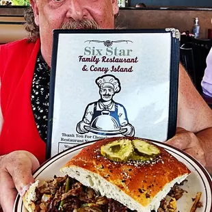 a man holding a plate of food