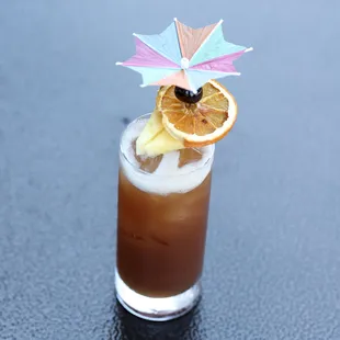 a drink with an umbrella on top