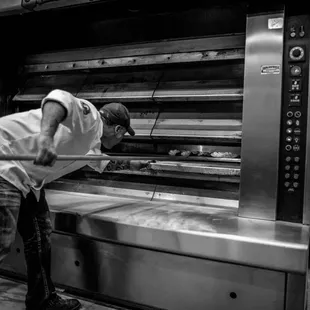 a man working in the oven