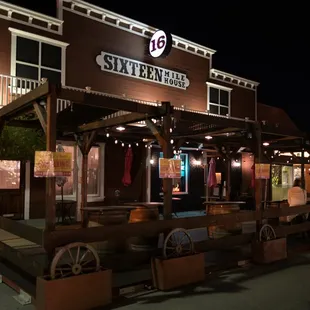 16 Mile House at night during COVID-19 pandemic. Temporary outdoor dining area is set up in the street.