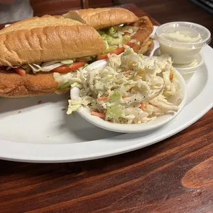 Fish sandwich with coleslaw.