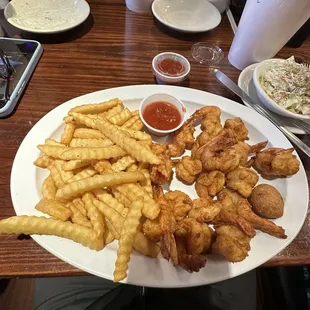 18 fried shrimp with fries and coleslaw.