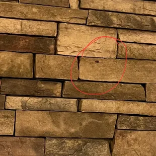 a red circle on a stone wall