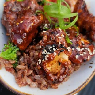 Korean crispy chicken with purple rice and kimchey.