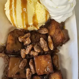 a dessert with ice cream and caramel sauce