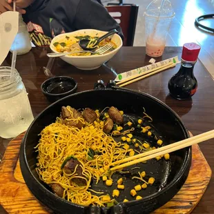 Spicy Miso Ramen Lunch and Strawberry Bubble Smoothie, close hot plate has Ribeye Steak Dinner with noodles