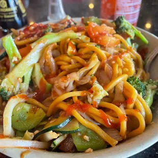 a plate of noodles and vegetables