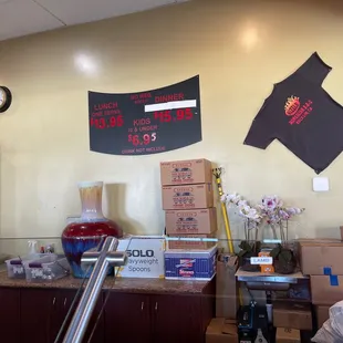 a counter with boxes and a clock