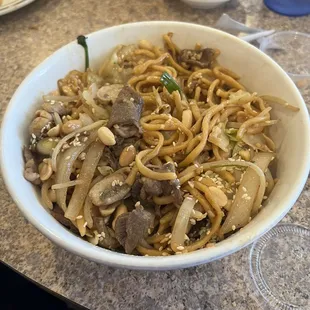 Beef and noodles with some veggies.