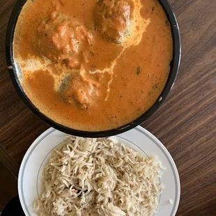 a plate of rice and meatballs