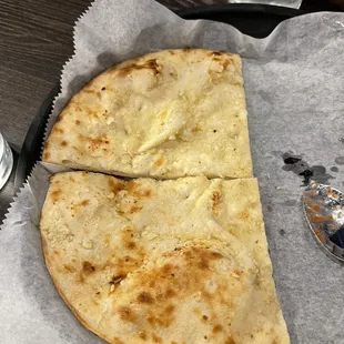 Half of the garlic naan order
