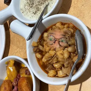 three bowls of food on a table