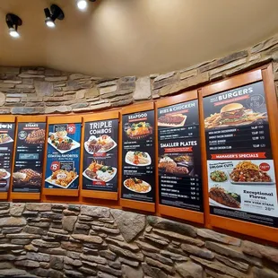 menus on a stone wall in a restaurant
