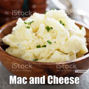 a wooden bowl filled with mashed potatoes