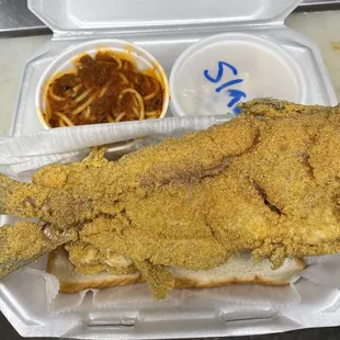 fried fish in a styrofoam container