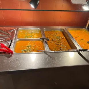 a variety of food in a buffet
