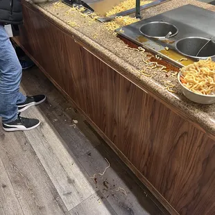 a man standing in front of a buffet
