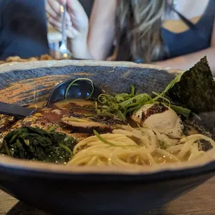 a bowl of ramen with a spoon in it