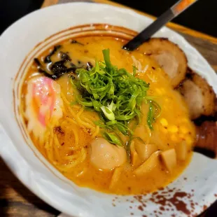 a bowl of soup with meat and vegetables