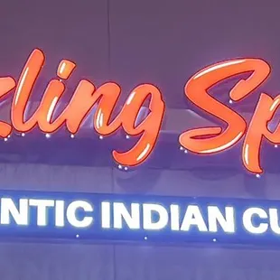 a neon sign for a restaurant