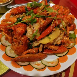 a plate of crab and vegetables