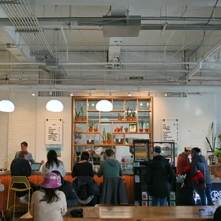 a group of people in a coffee shop
