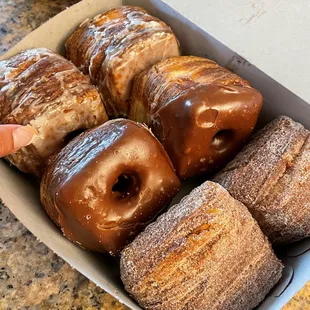 cronuts in all flavors: glazed, chocolate, sugared