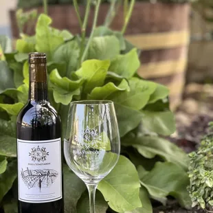 a glass of wine and a bottle of wine