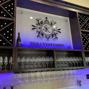 a bar with wine glasses