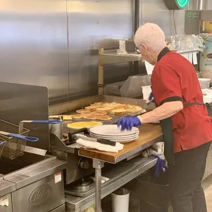 Owner cooking it up.