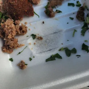 half eaten food in a styrofoam container