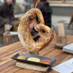 Giant warm pretzel with 3 mustards