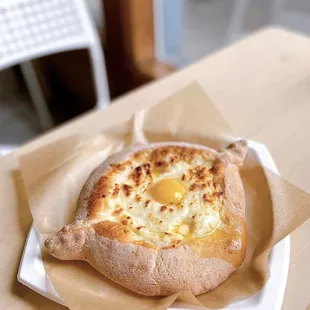 Adjaruli Khachapuri | melty cheese, grass-fed butter, organic soft runny yolk