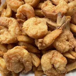 Fried shrimp dinner with fries, it also came with a side of coleslaw.