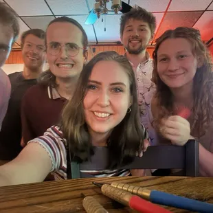 Group in the back bar area by dart boards