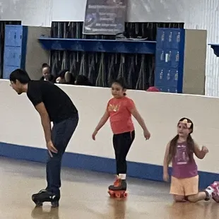 Kids learning to skate and having fun